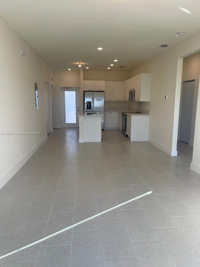 interior space with light tile patterned floors