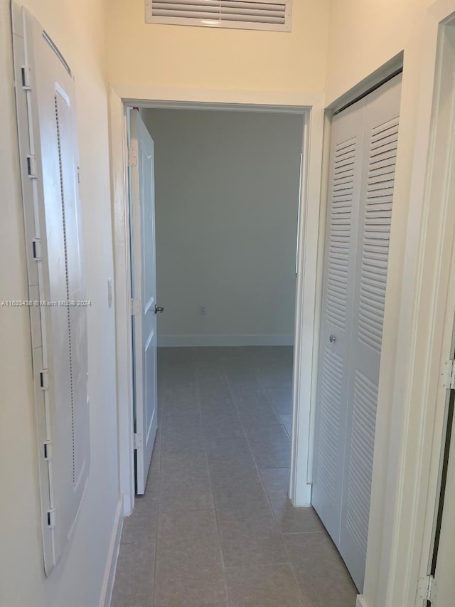 hall featuring tile patterned flooring