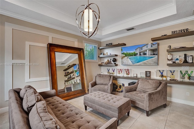 tiled living room featuring a notable chandelier, a tray ceiling, and ornamental molding