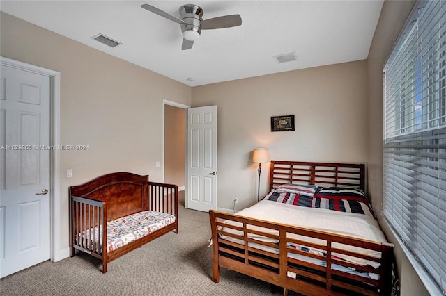 carpeted bedroom with ceiling fan