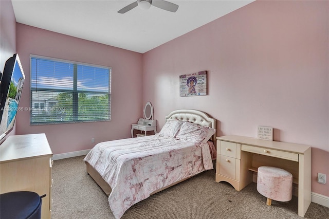 bedroom with ceiling fan and light carpet