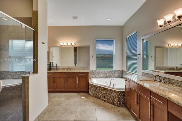 bathroom featuring tile patterned floors, independent shower and bath, and vanity