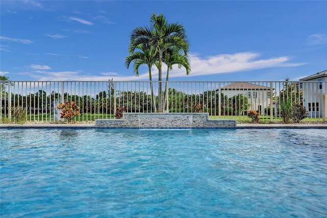 view of pool featuring pool water feature