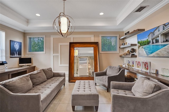 living room with a notable chandelier, a raised ceiling, crown molding, and light tile patterned floors