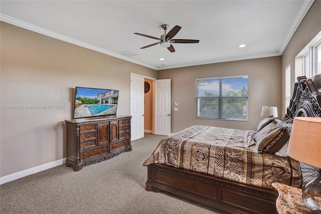 bedroom featuring crown molding, ceiling fan, and carpet