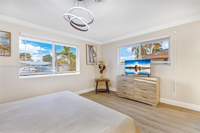 5740 NE 19th Ave, Fort Lauderdale, FL 33308 - bedroom with baseboards, a notable chandelier, wood finished floors, and crown molding