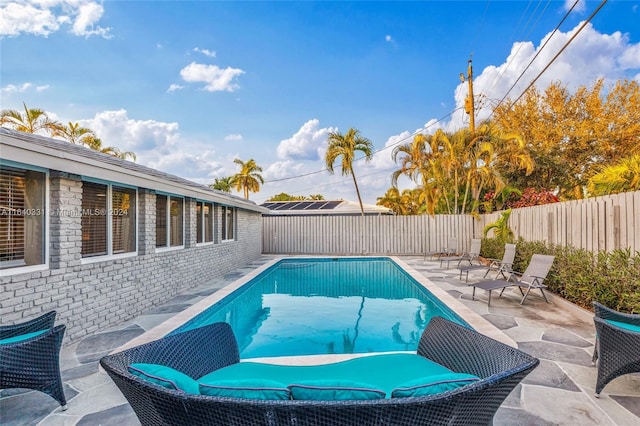 5740 NE 19th Ave, Fort Lauderdale, FL 33308 - view of swimming pool featuring a fenced backyard, a fenced in pool, and a patio