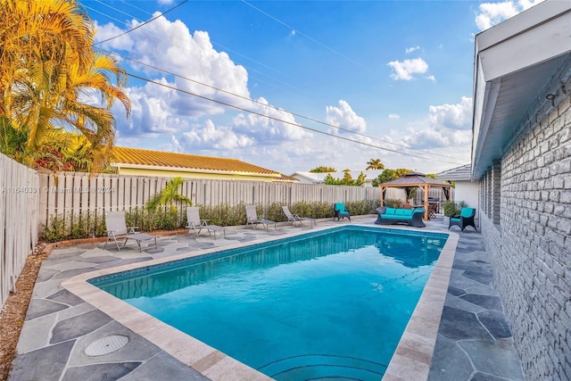 5740 NE 19th Ave, Fort Lauderdale, FL 33308 - view of pool with a fenced backyard, a gazebo, a patio area, and a fenced in pool
