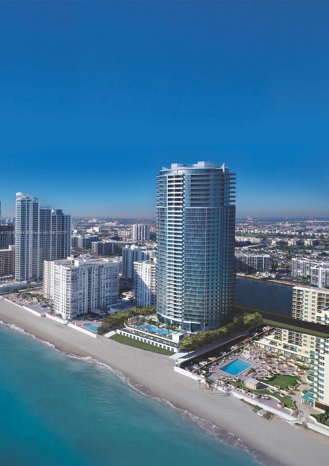 exterior space featuring a water view and a view of the beach