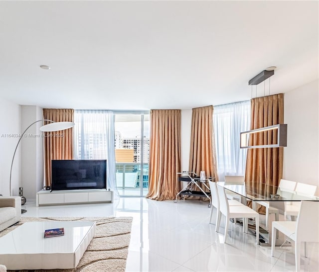 living room featuring floor to ceiling windows