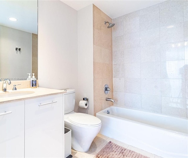 full bathroom with vanity, tiled shower / bath combo, tile patterned floors, and toilet