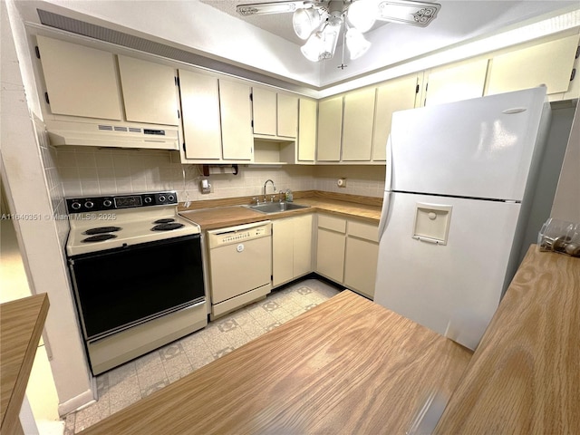 kitchen with sink, white appliances, ceiling fan, backsplash, and cream cabinets