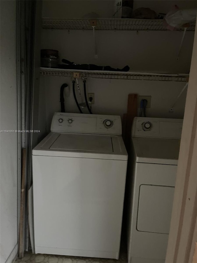 laundry room with washing machine and clothes dryer