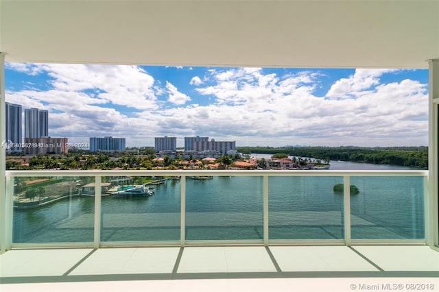 balcony featuring a water view