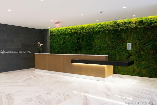 400 Sunny Isles Blvd Unit 1019, Sunny Isles Beach, FL 33160 - reception area featuring tile walls and recessed lighting