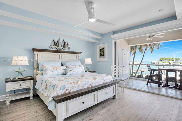 bedroom with ceiling fan, light hardwood / wood-style flooring, and access to exterior