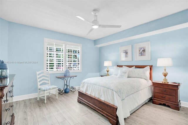 bedroom featuring ceiling fan and light hardwood / wood-style flooring