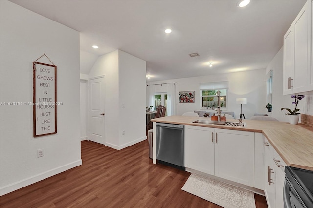 kitchen featuring stainless steel appliances, butcher block counters, dark hardwood / wood-style flooring, white cabinets, and sink