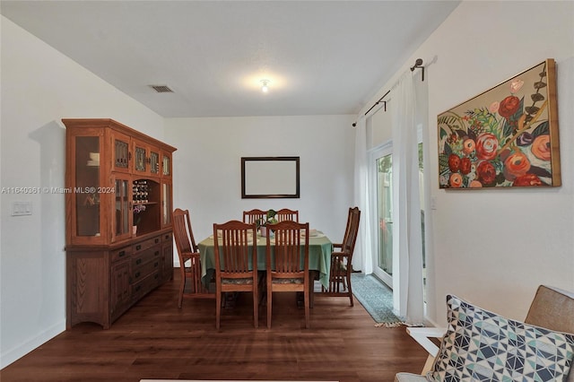 dining room with dark hardwood / wood-style floors