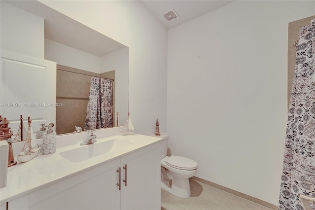 bathroom featuring toilet, a shower with curtain, vanity, and tile patterned flooring