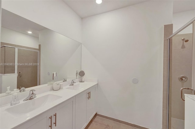 bathroom with vanity, tile patterned floors, and an enclosed shower