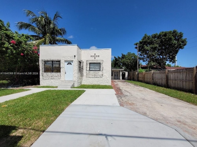 exterior space with a front lawn