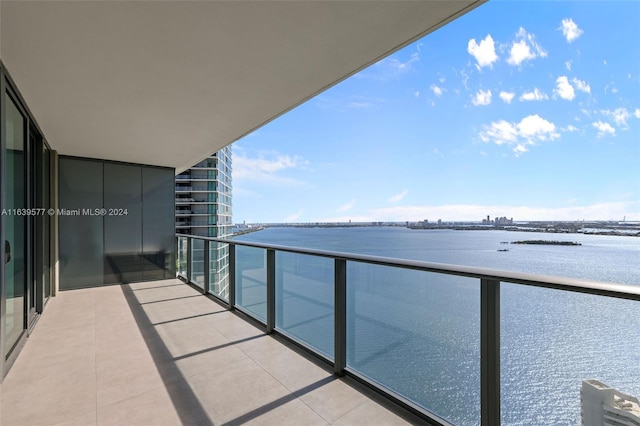 balcony featuring a water view