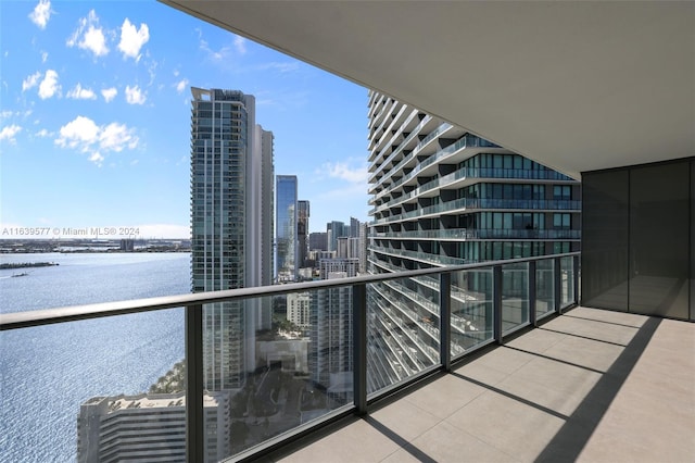 balcony featuring a water view