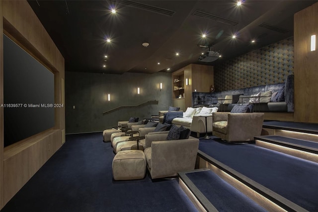 home theater with dark colored carpet