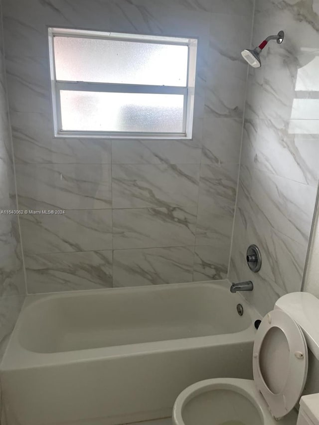 full bathroom with toilet and shower / bath combination