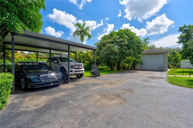 view of parking featuring a garage, a yard, and a carport