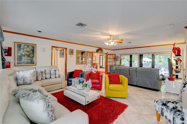 living room featuring ceiling fan, light tile patterned floors, and crown molding