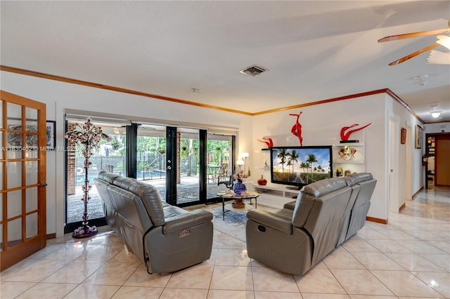 living room featuring ceiling fan, ornamental molding, light tile patterned floors, and french doors