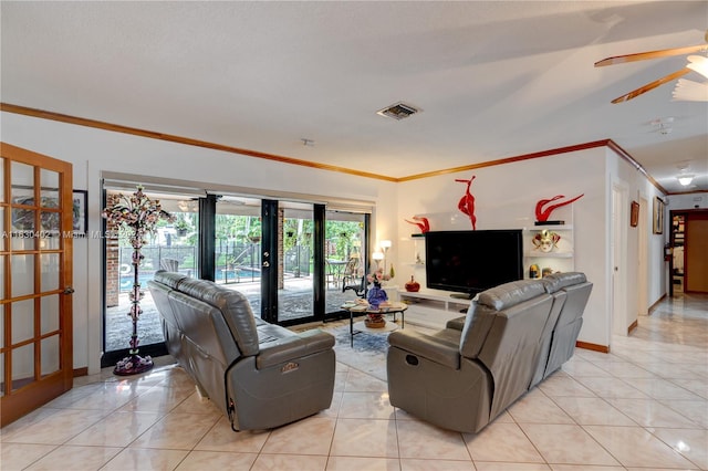 living room featuring crown molding, french doors, light tile patterned floors, and ceiling fan