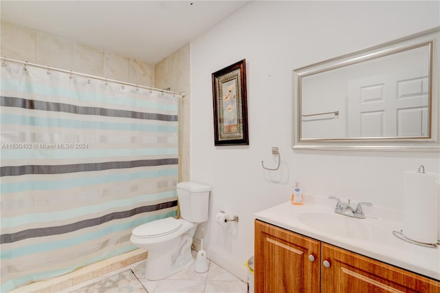 bathroom with a shower with curtain, tile patterned flooring, toilet, and vanity