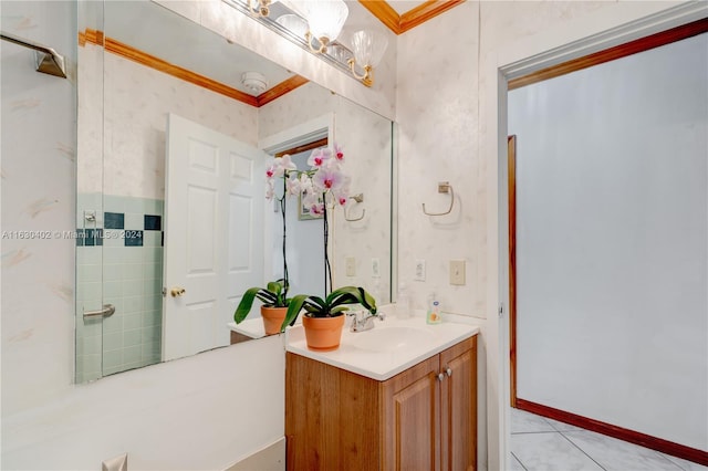 bathroom with crown molding, vanity, and tile patterned flooring