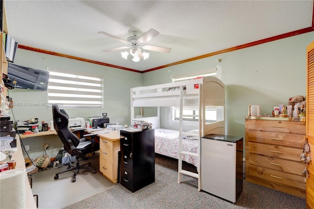 office area featuring a textured ceiling, crown molding, ceiling fan, and light carpet