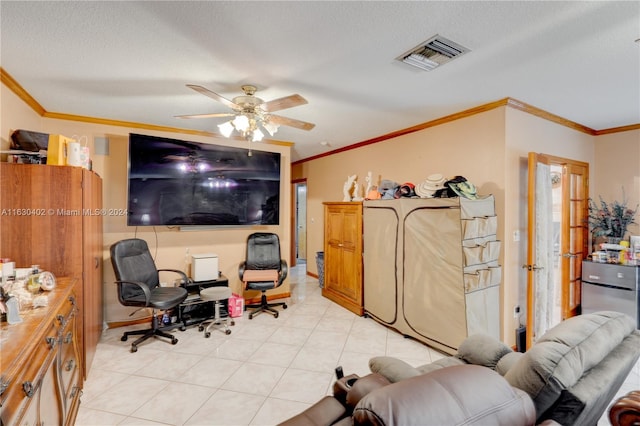 tiled home office with ceiling fan, crown molding, and a textured ceiling