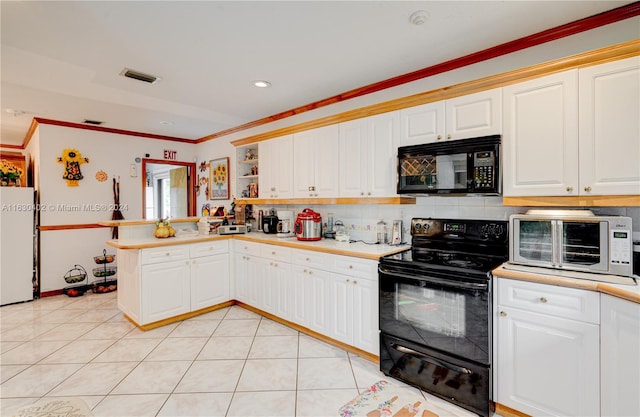 kitchen with crown molding, black appliances, tasteful backsplash, and light tile patterned flooring