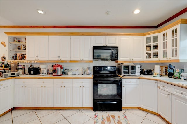 kitchen with crown molding, black appliances, tasteful backsplash, and light tile patterned floors