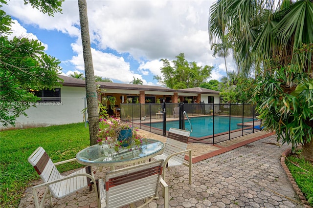 view of pool featuring a patio area