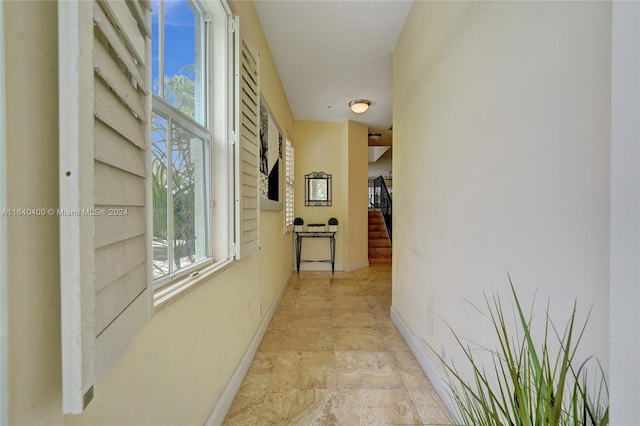 corridor featuring light tile patterned flooring