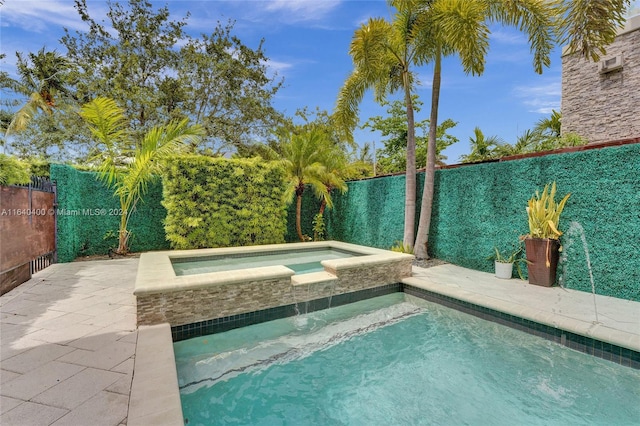 view of pool featuring a fenced in pool, a fenced backyard, a patio, and an in ground hot tub