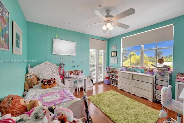 bedroom with wood finished floors and a ceiling fan