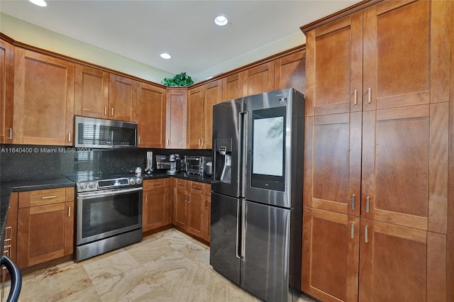 kitchen with recessed lighting, appliances with stainless steel finishes, brown cabinets, decorative backsplash, and dark stone countertops