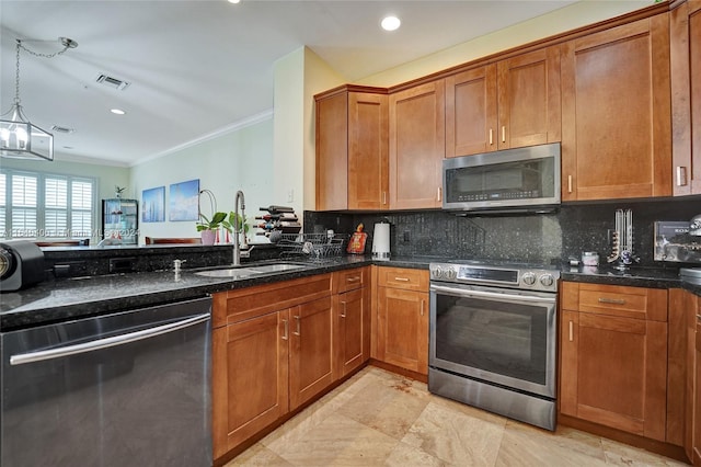 kitchen with stainless steel appliances, light tile patterned floors, hanging light fixtures, sink, and tasteful backsplash