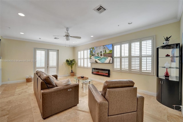 tiled living room featuring ceiling fan and crown molding