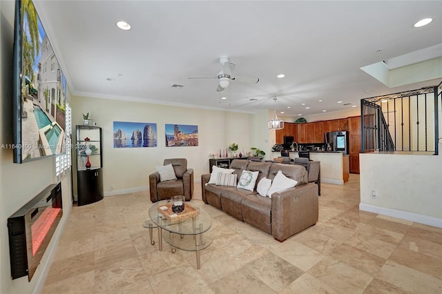 living room featuring recessed lighting, visible vents, a ceiling fan, ornamental molding, and baseboards