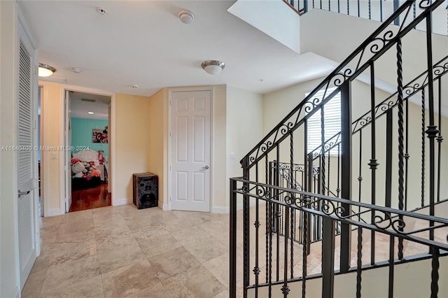 corridor with stairs and baseboards