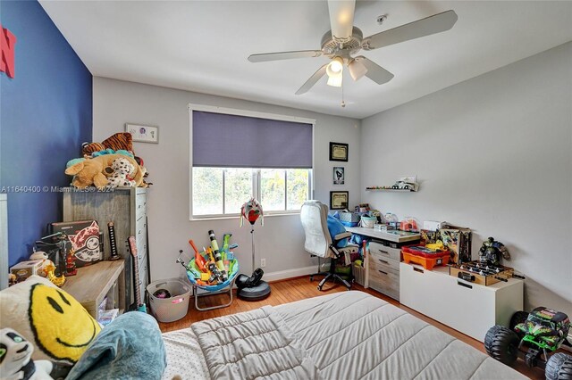 bedroom featuring hardwood / wood-style flooring and ceiling fan